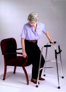 Sitting Down on a Chair Using a Rollator